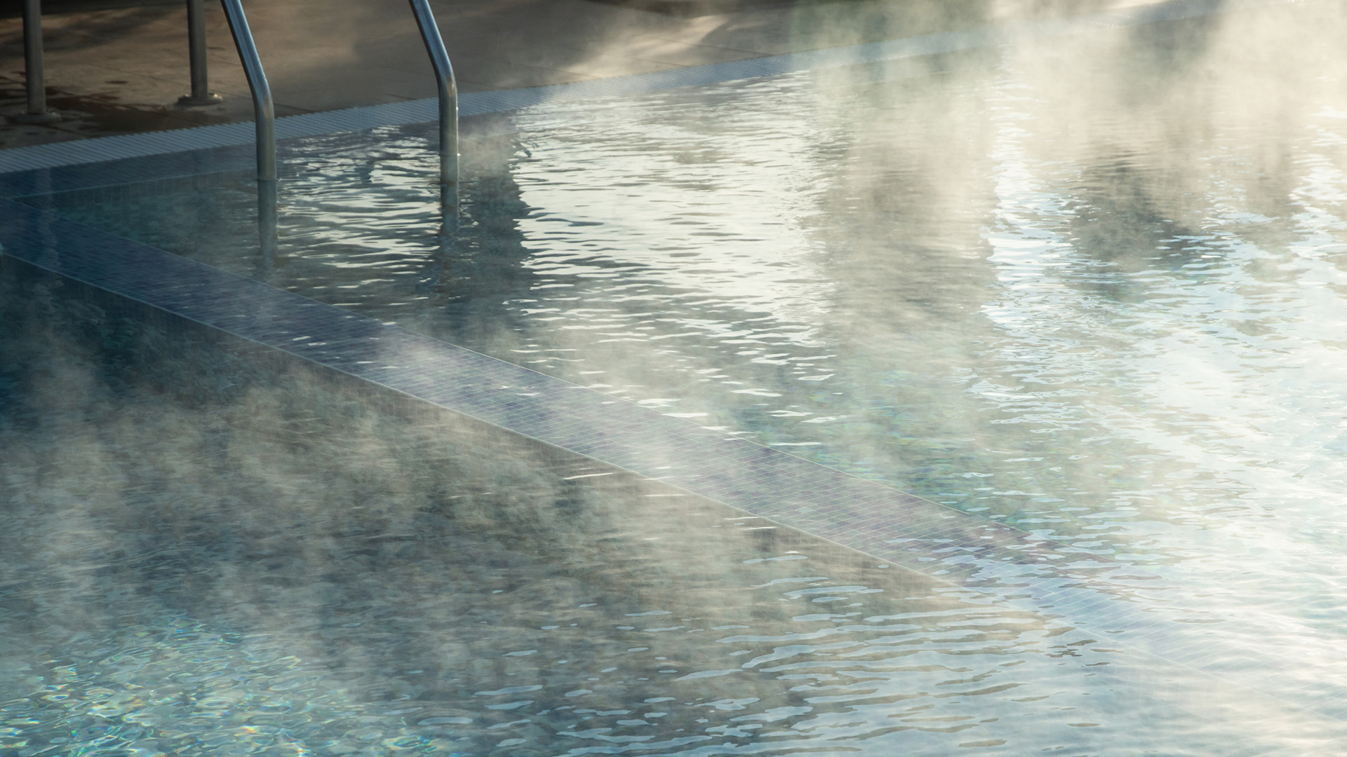 a pool with steam coming out of it