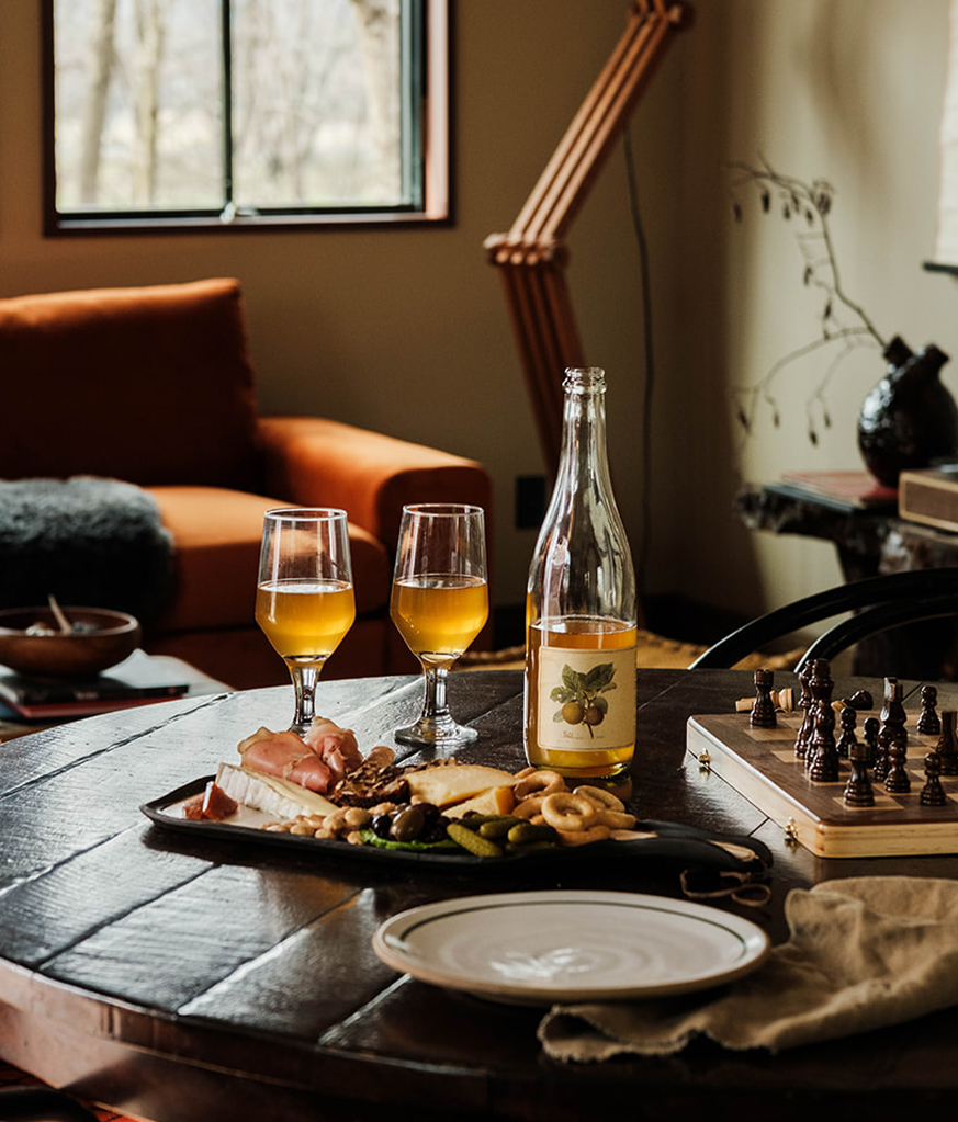 a table with wine glasses and food on it