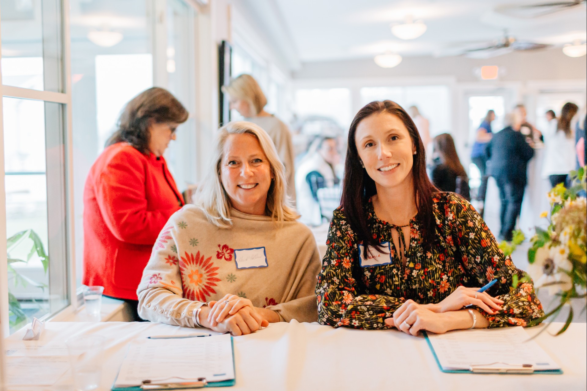 a group of women sitting at a table