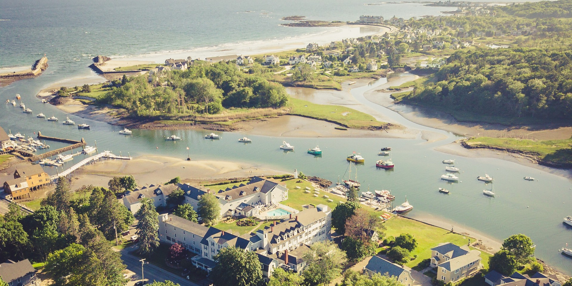 a aerial view of a town and a body of water