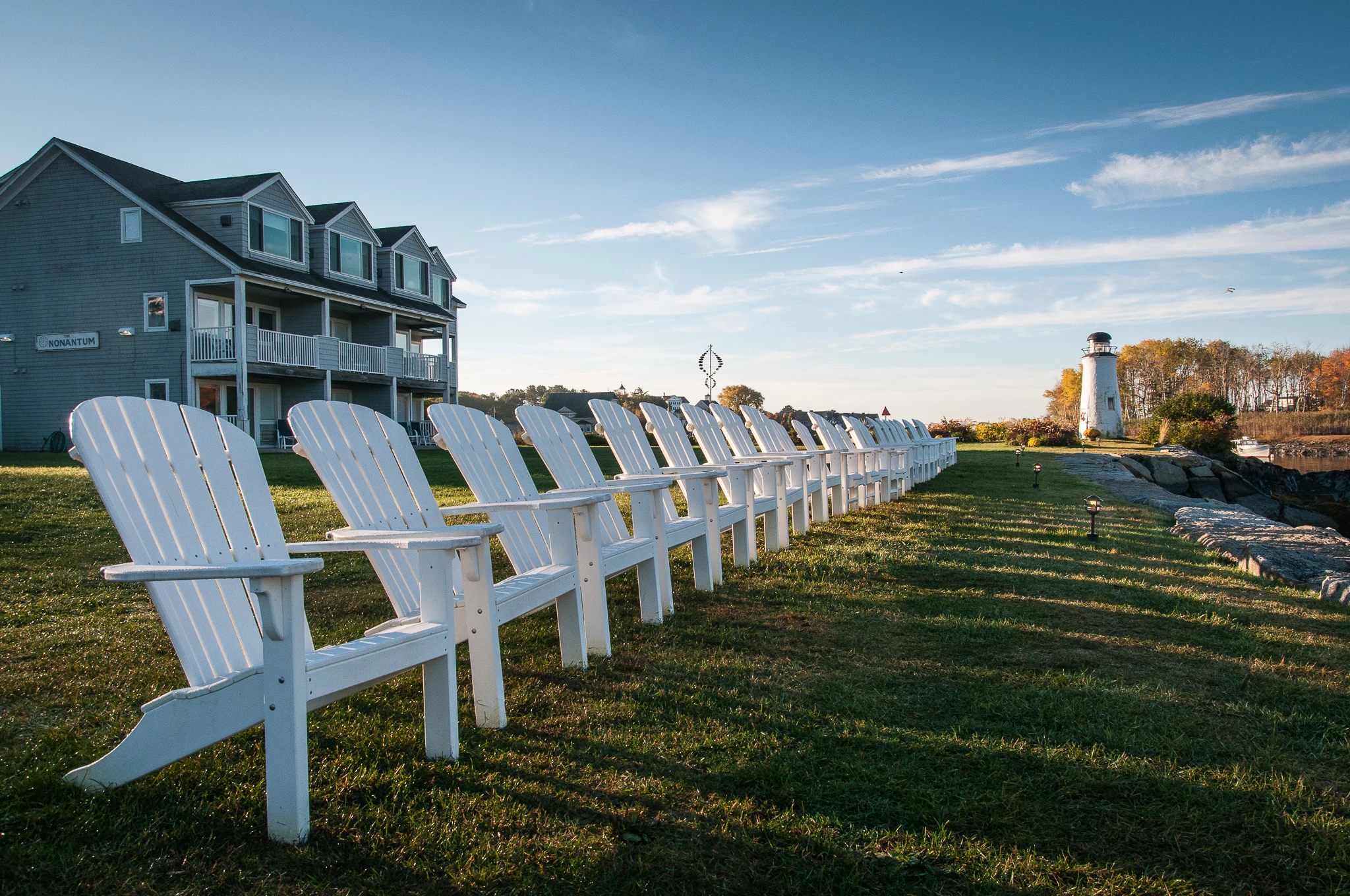 a row of white chairs in a row