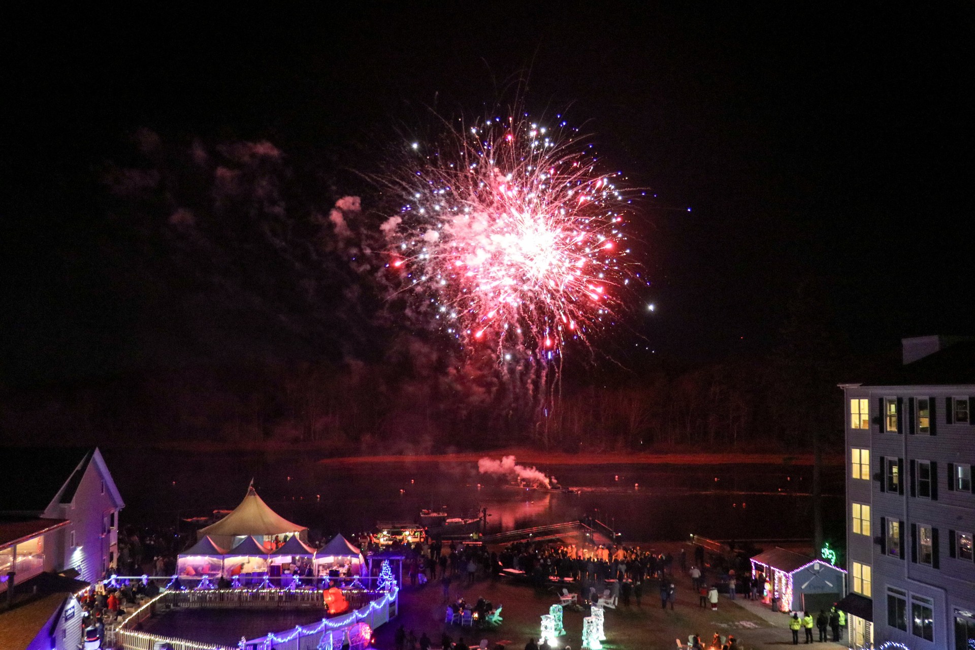 fireworks in the sky over a lake