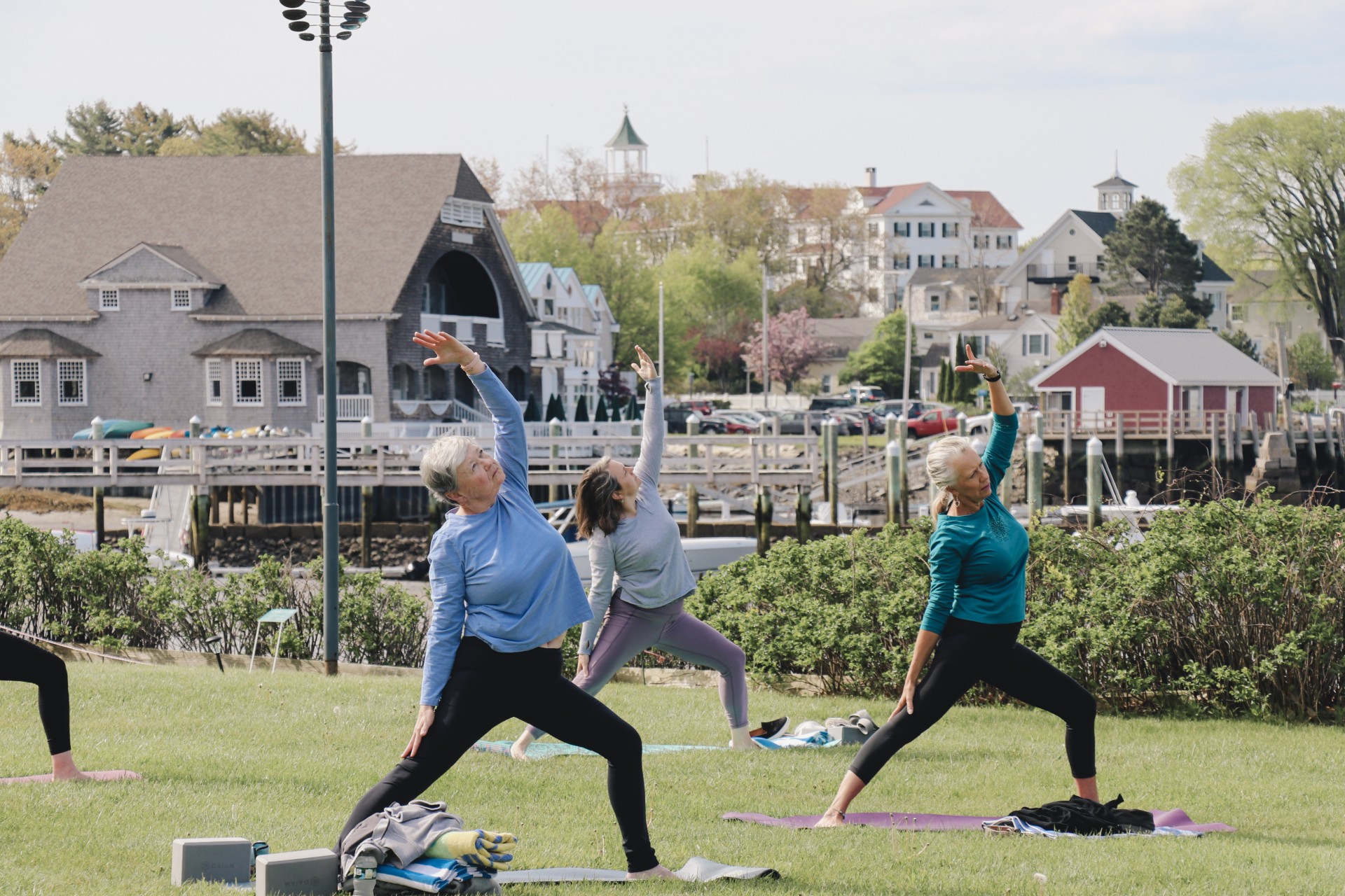 a group of women doing yoga outside