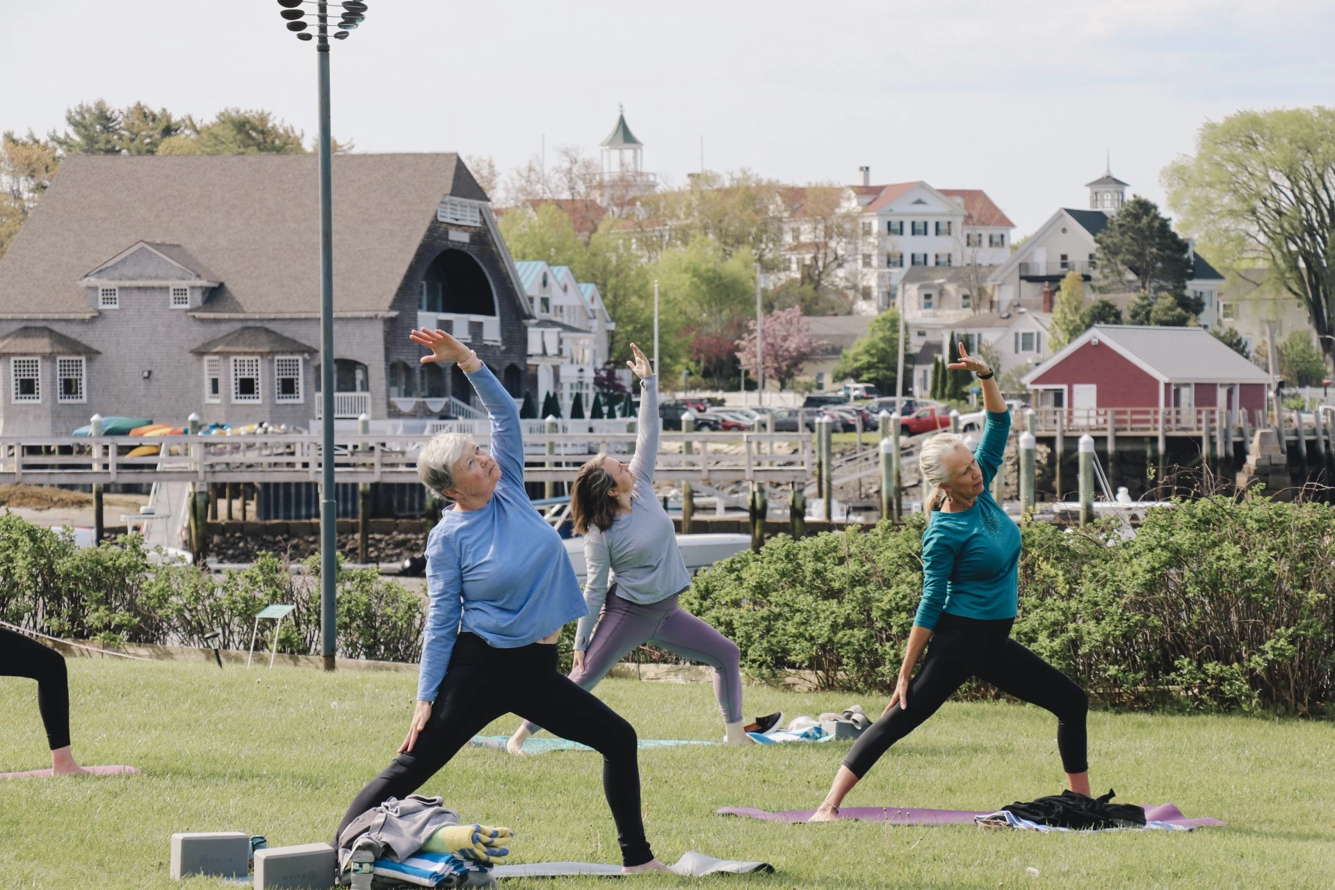a group of women doing yoga outside