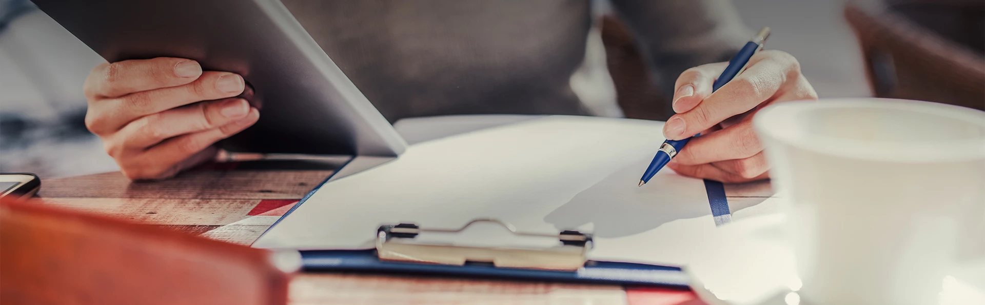 A person signing papers