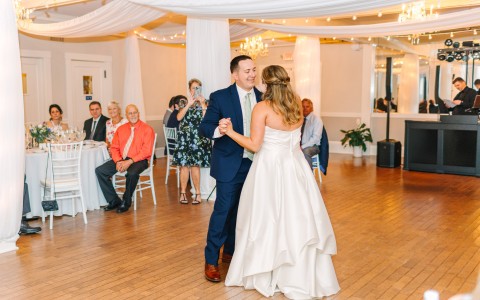 a man and woman dancing in a room