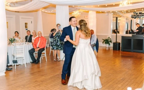 a man and woman dancing in a room