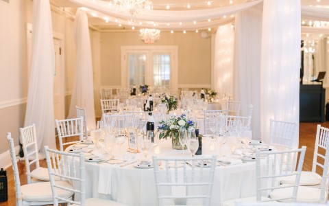 a white table set for a wedding reception
