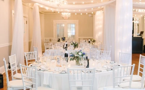 a white table set for a wedding reception