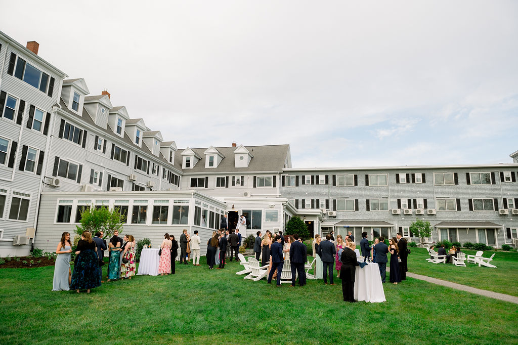 a group of people outside of a large building