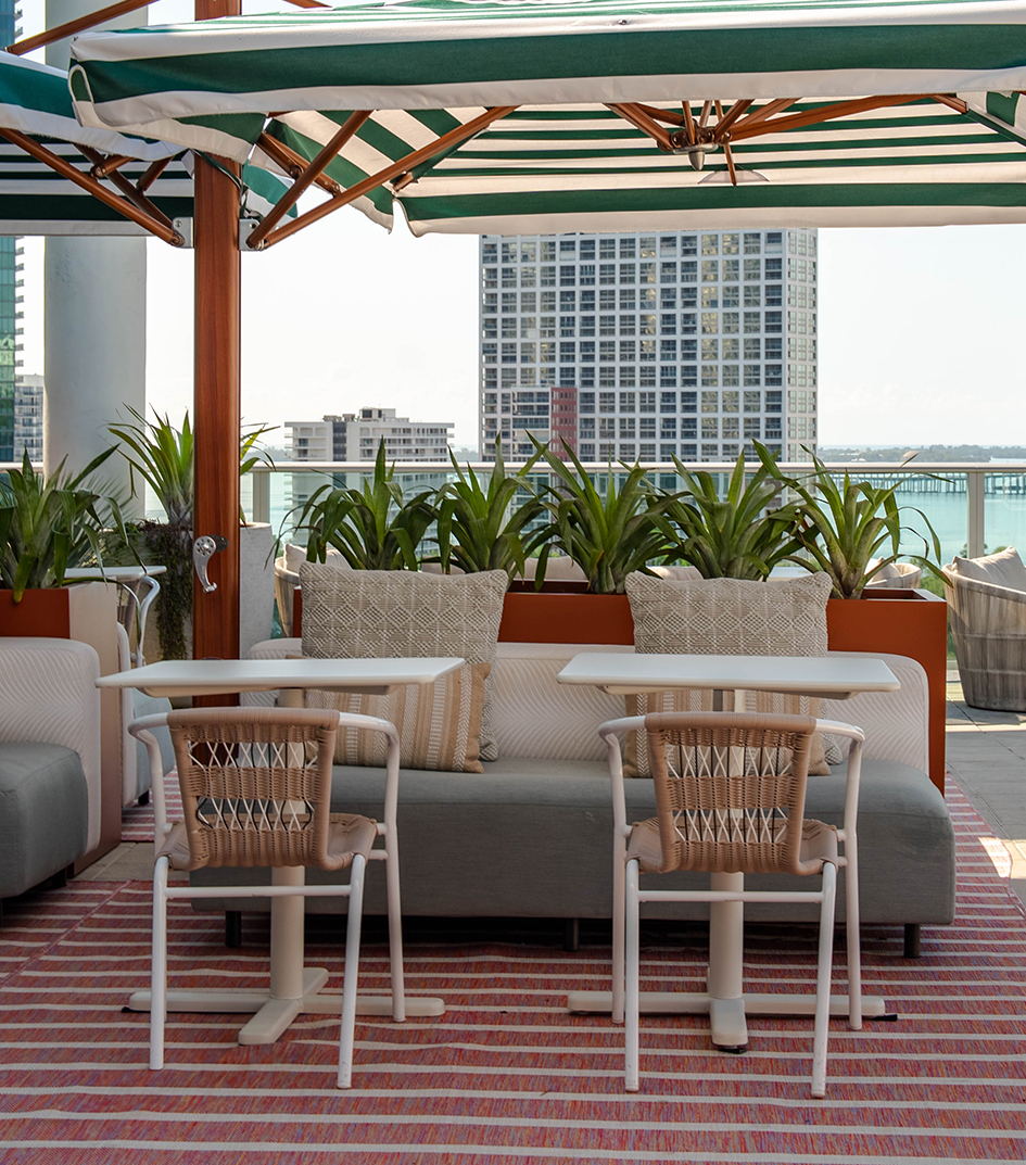 a patio with a couch and chairs