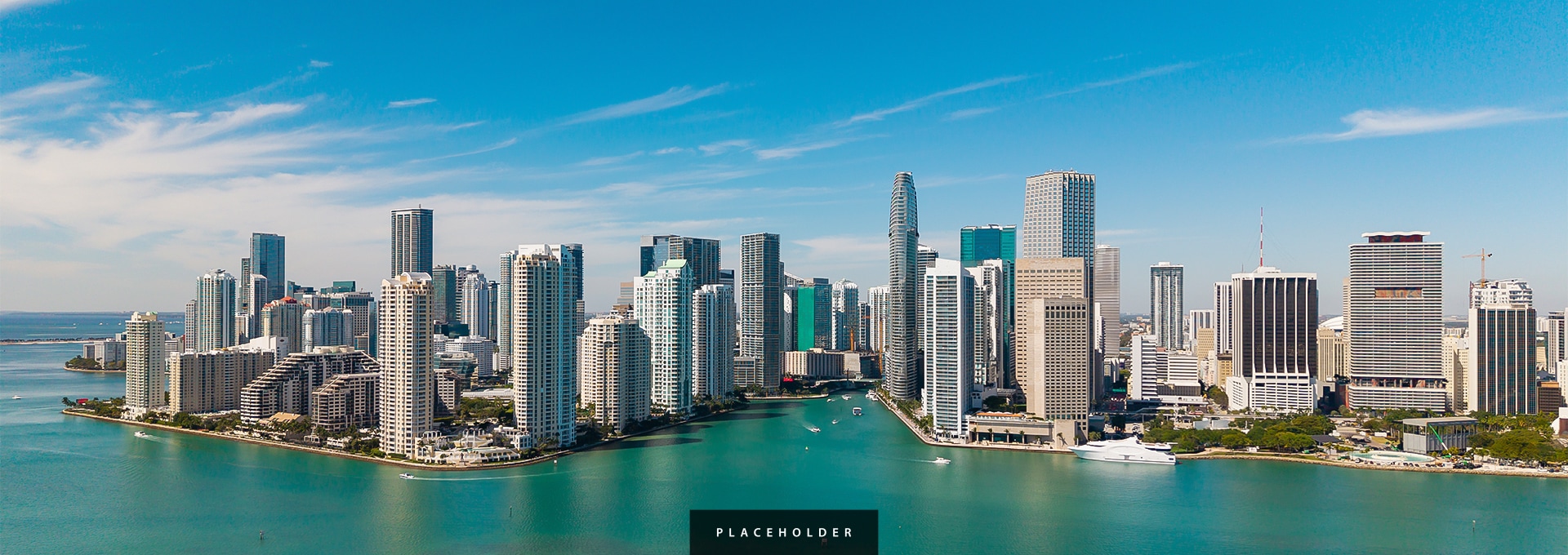 a city with tall buildings and a body of water