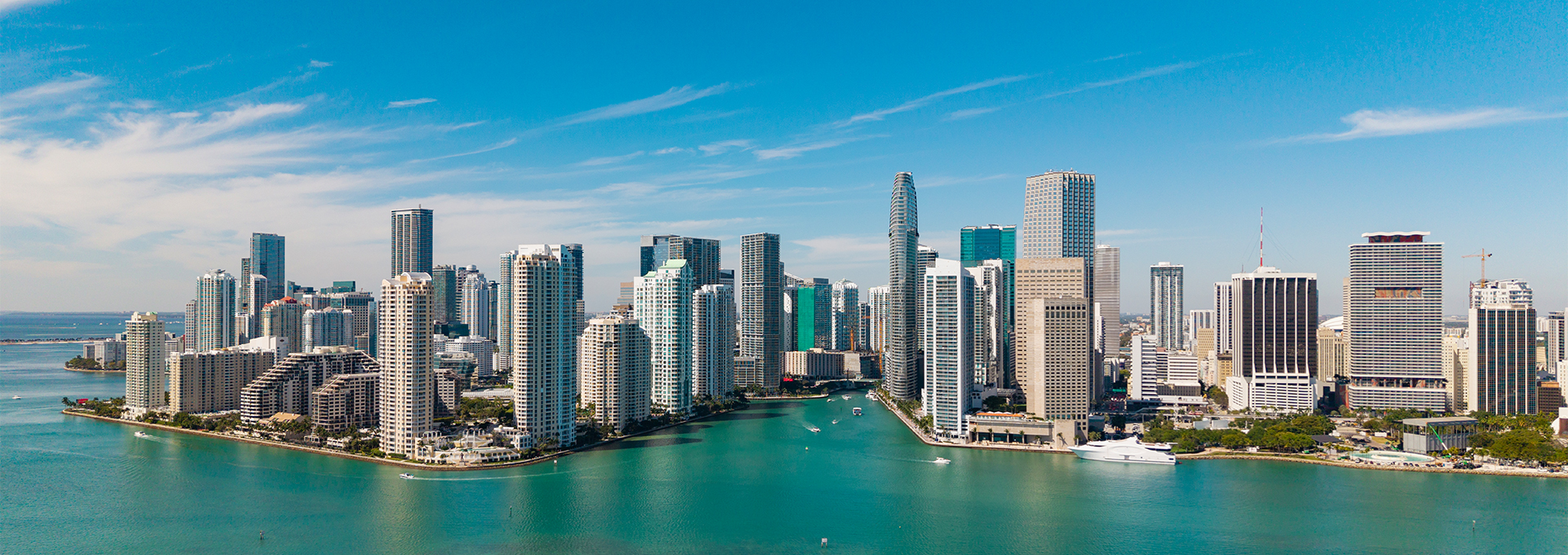 a city with tall buildings and a body of water