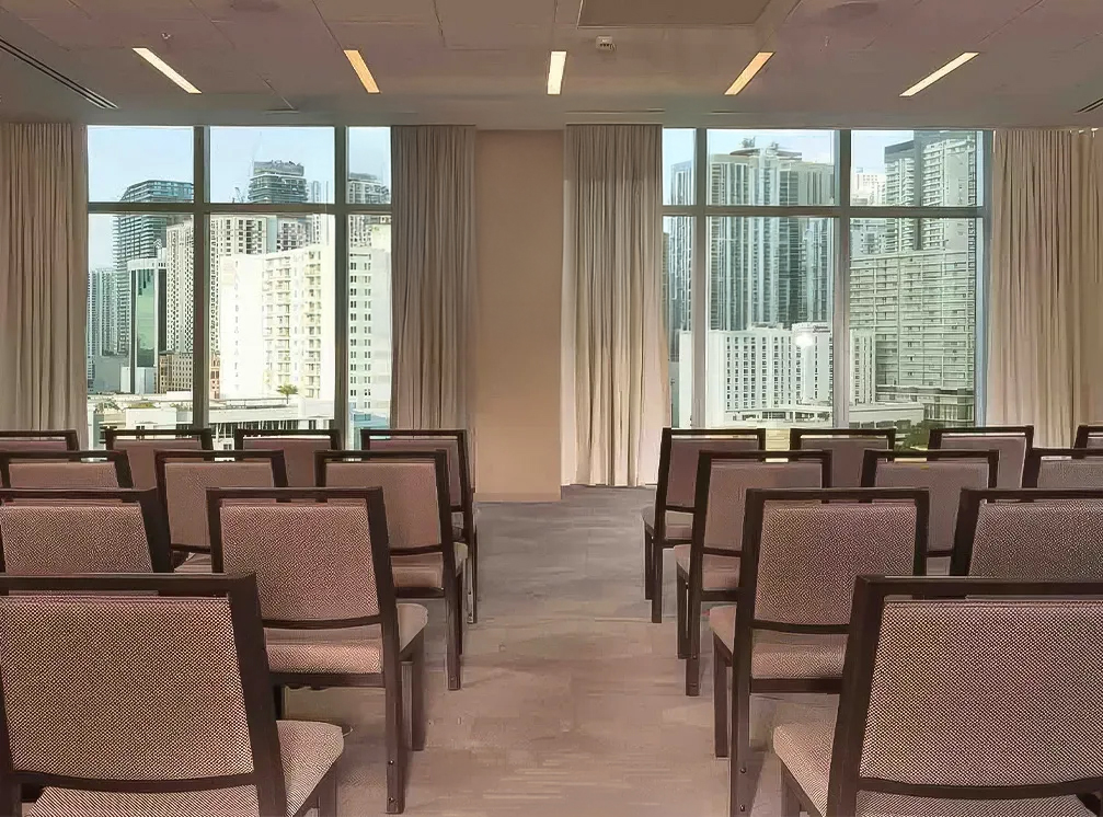 a room with many chairs and a window