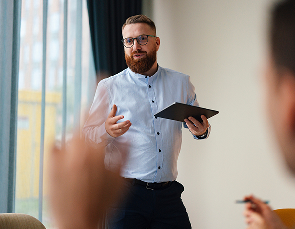 a man holding a tablet