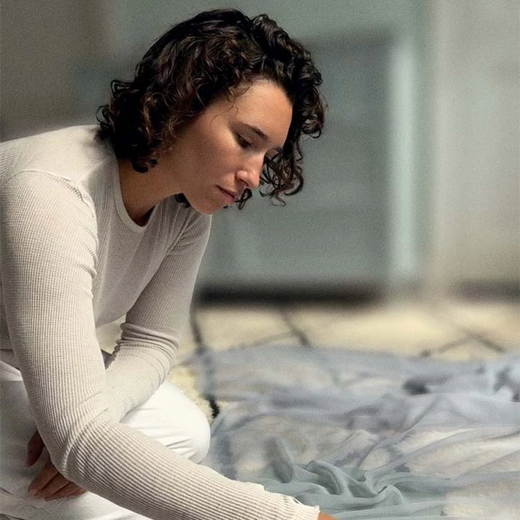 a woman kneeling on the floor