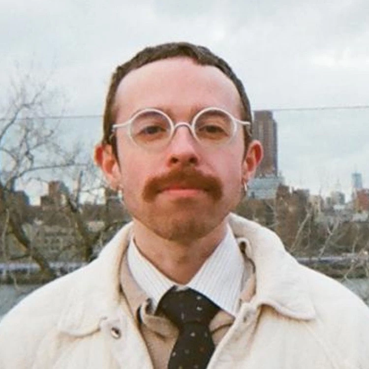 a man with glasses and a mustache