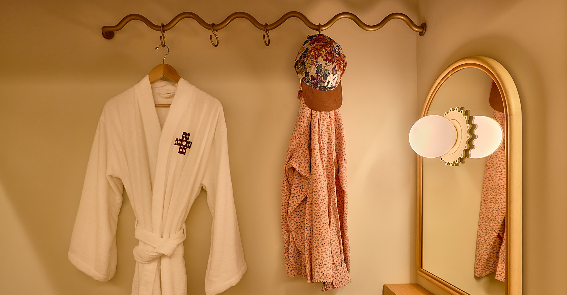 a robe and hat on a hook