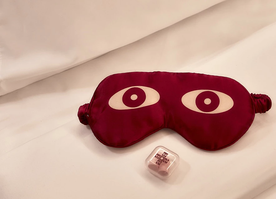 a eye mask and a plastic container