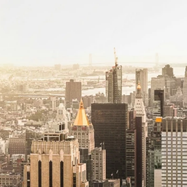 a city skyline with tall buildings
