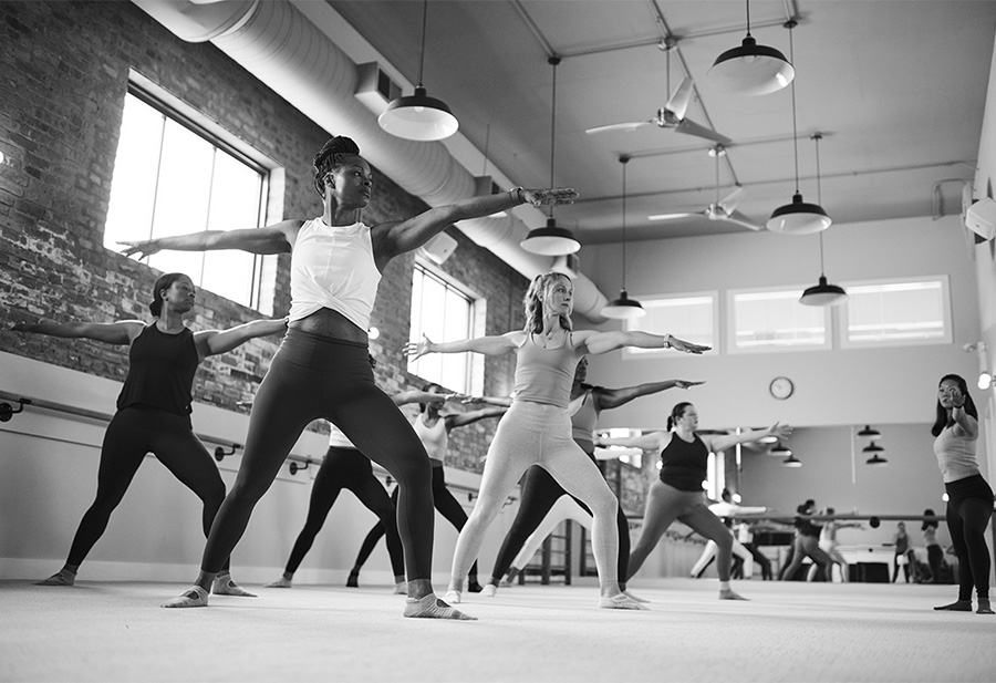 a group of women doing yoga