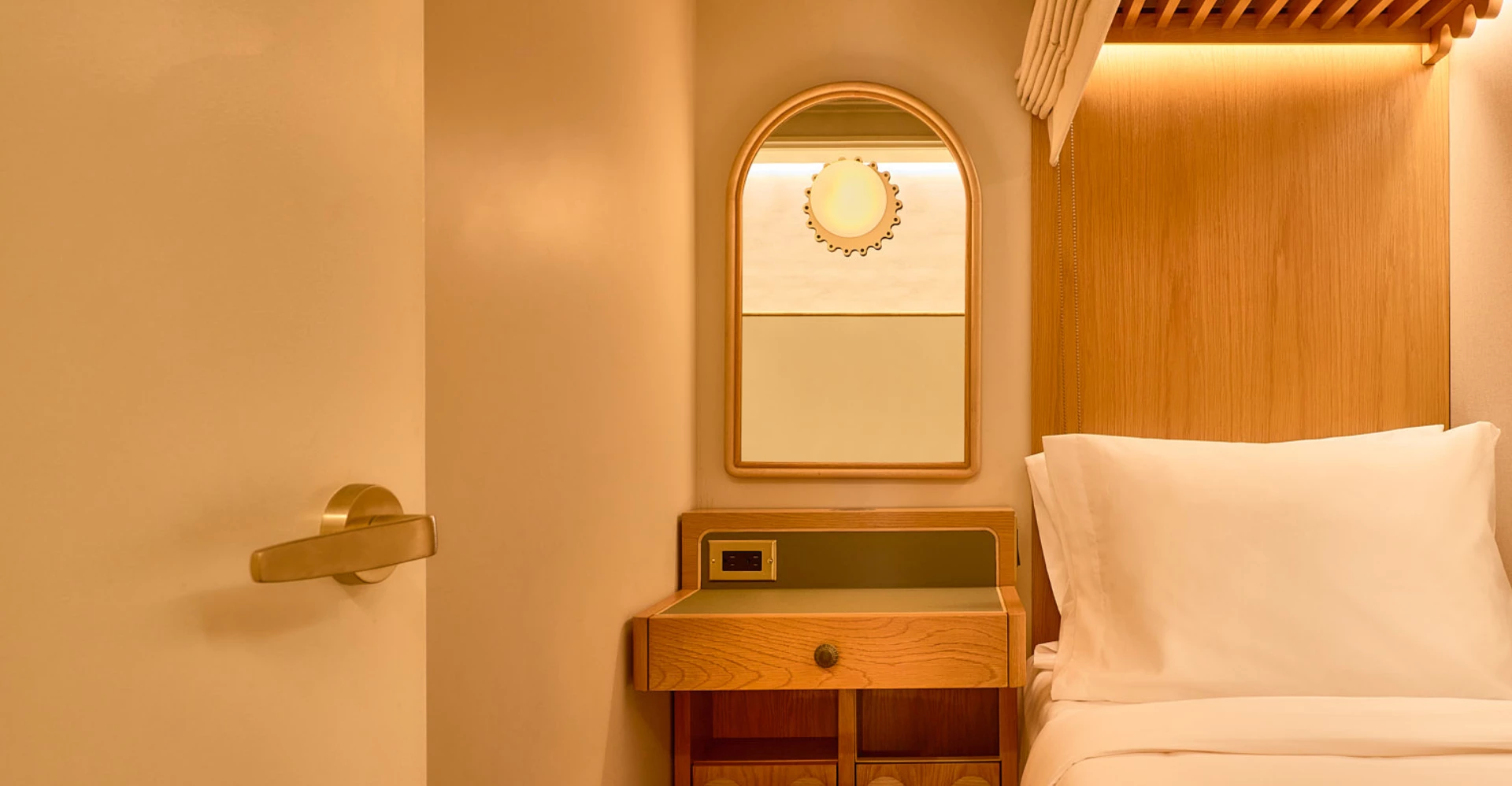 a mirror above a bed
