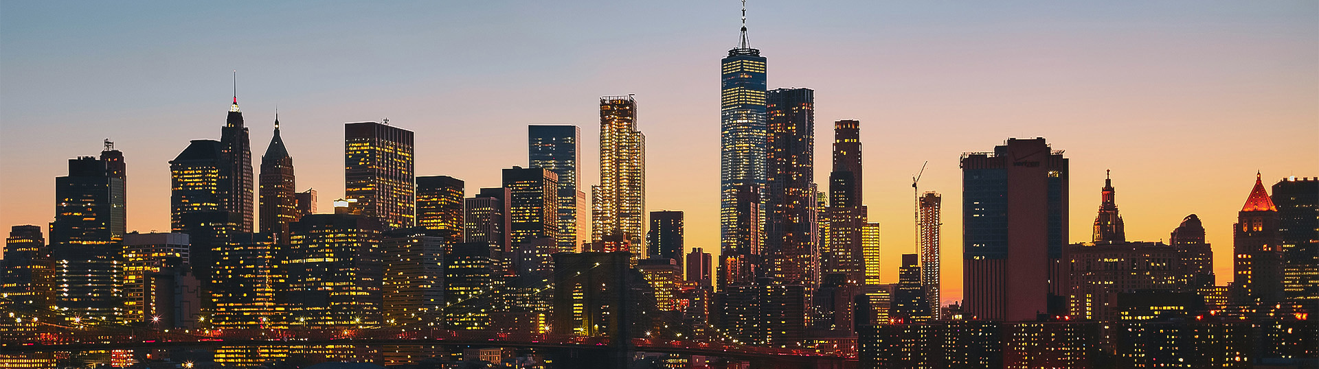a city skyline with many tall buildings