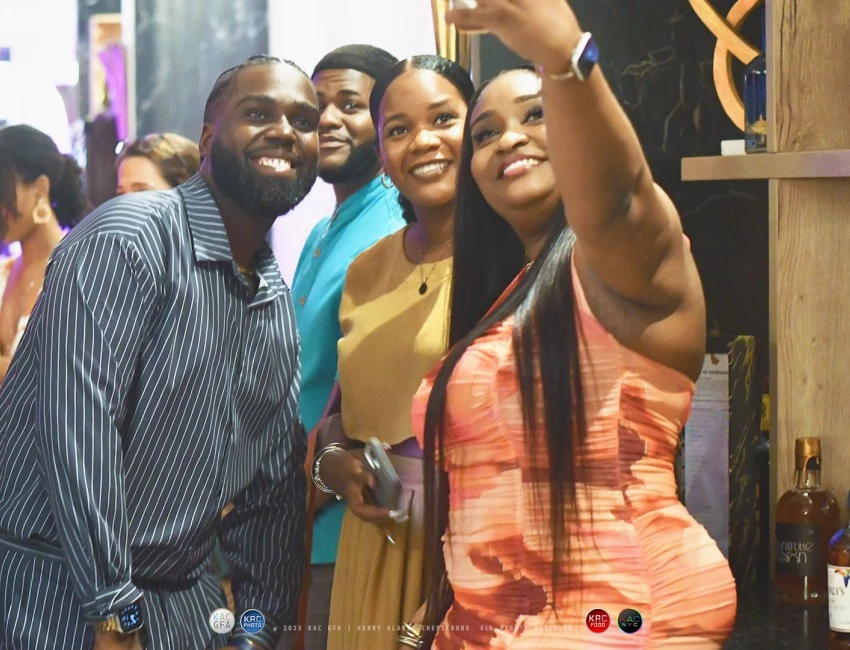 a group of people taking a selfie