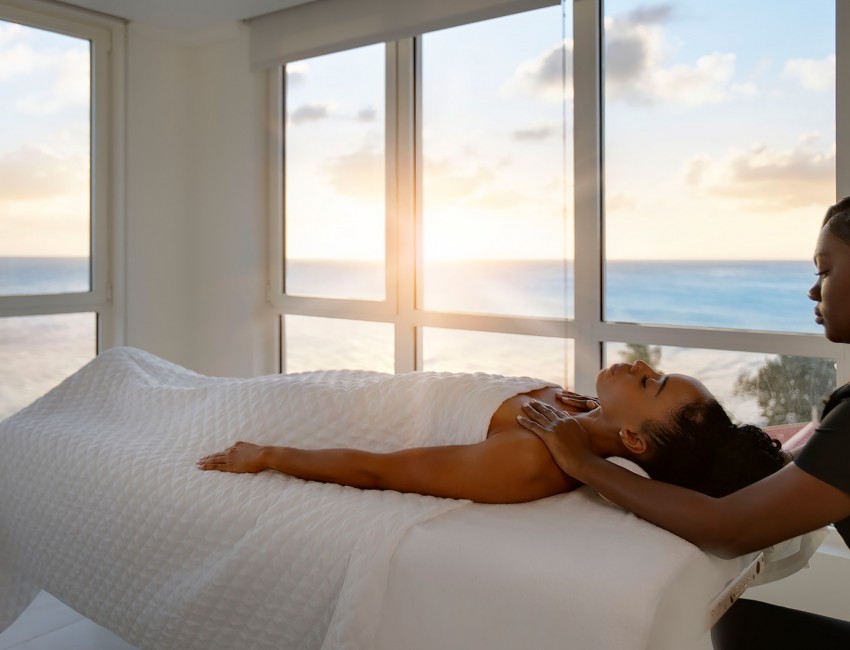 woman getting a massage at the resort spa