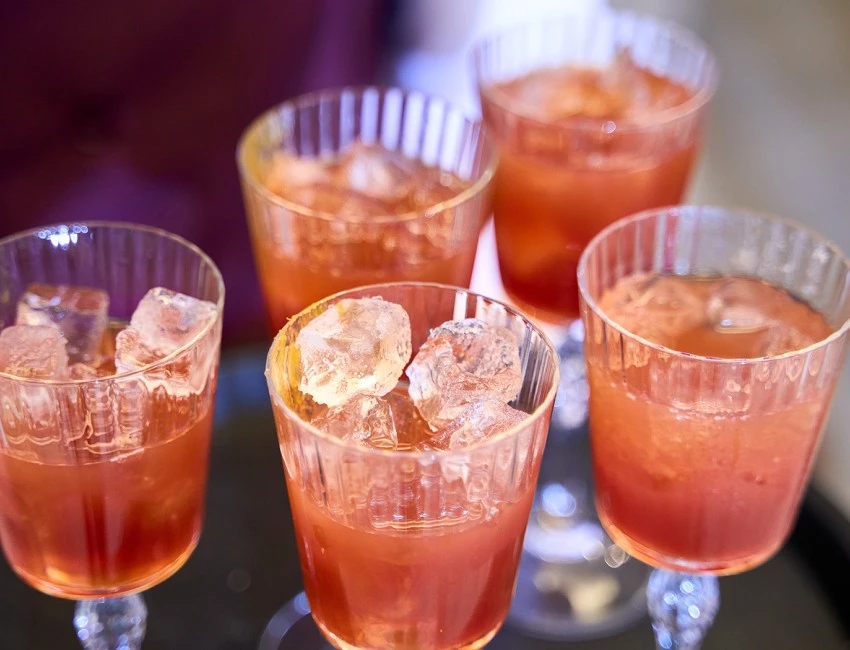 a group of glasses with liquid in them