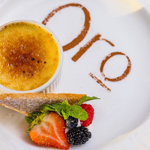 a plate with a dessert and a cup of coffee