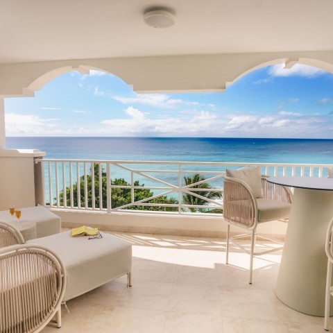 a balcony with a view of the ocean
