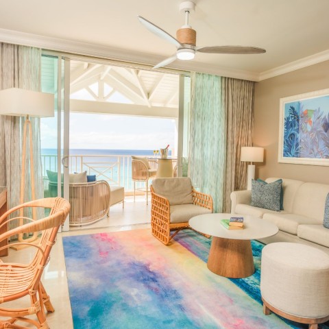 a living room with a couch and chairs