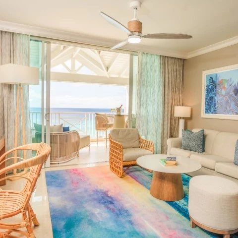 a living room with a couch and chairs