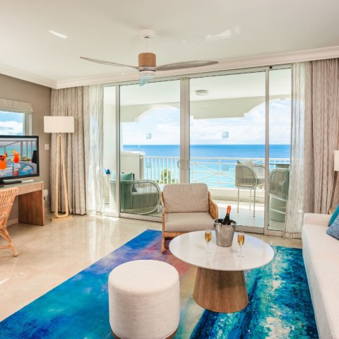 a living room with a television and a table