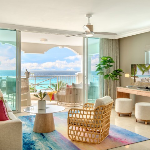 a living room with a view of the ocean