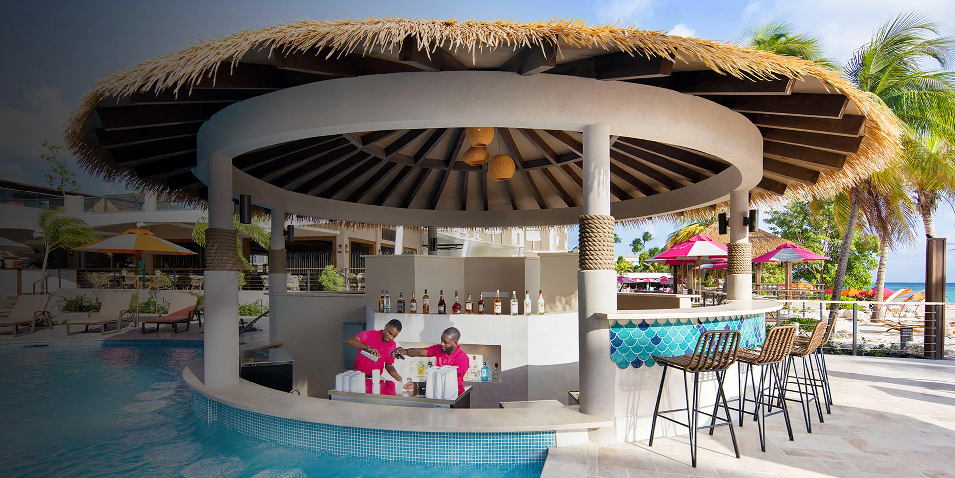 bartenders at swim up bar cabana