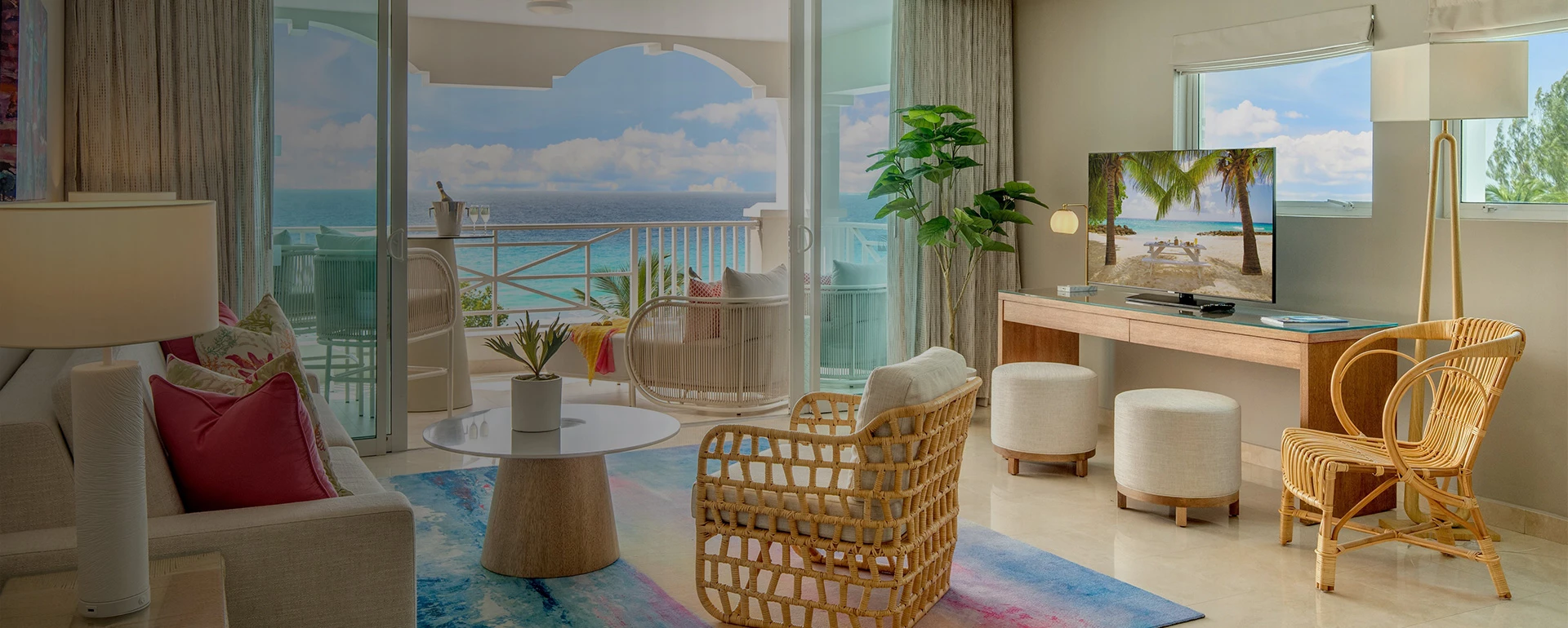 a room with a view of the ocean and a balcony