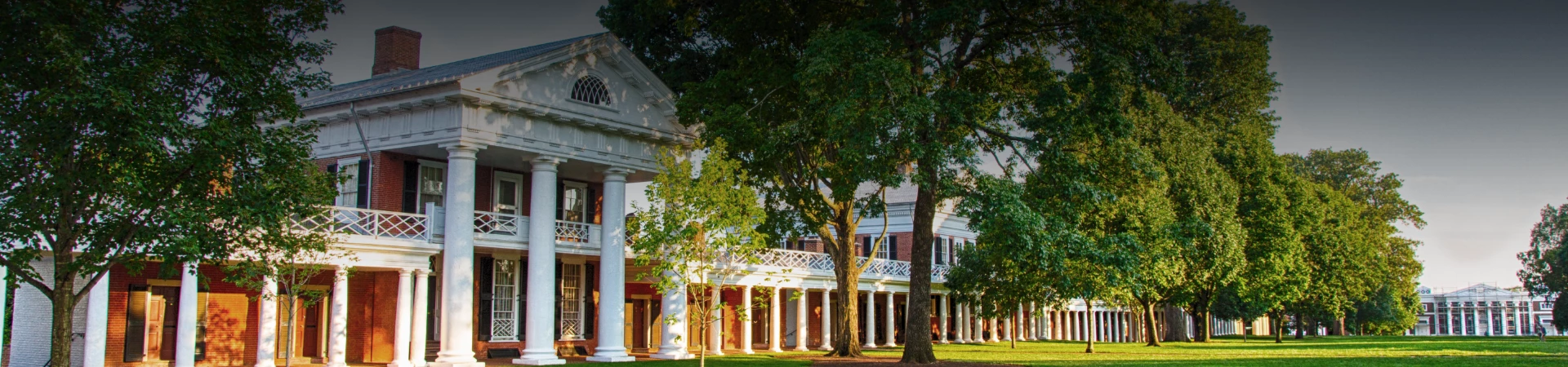 a large house with trees in front