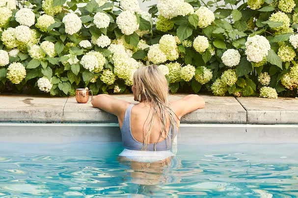 a woman sitting in a pool