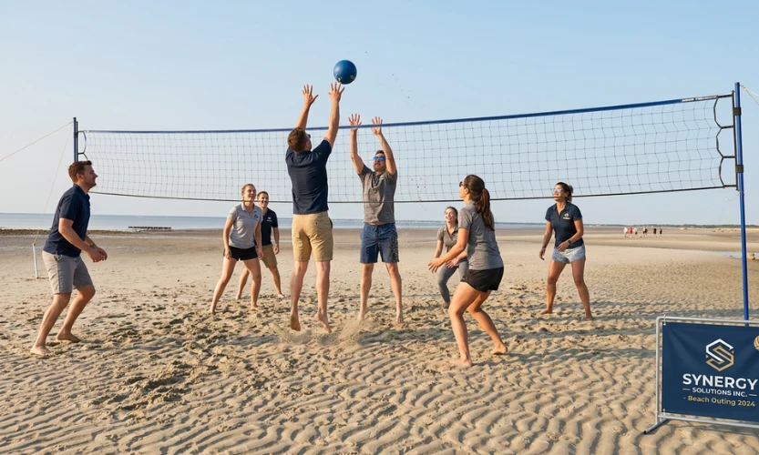 a group of people playing volleyball on a beach