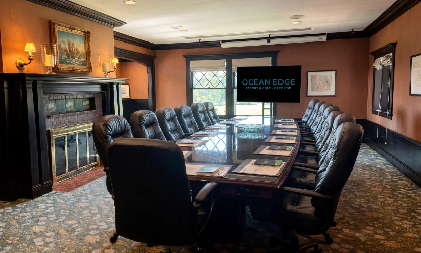 a conference room with a table and chairs