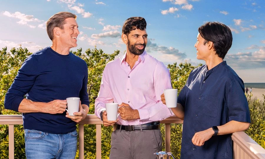 a group of people holding coffee cups
