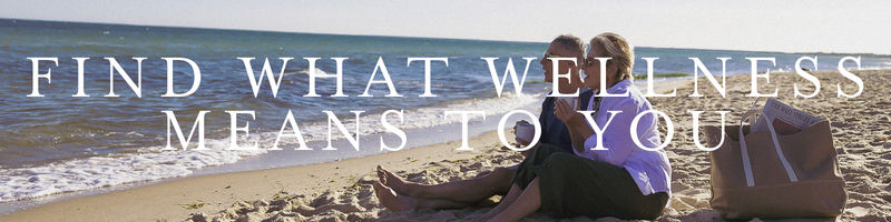 a couple sitting on the beach