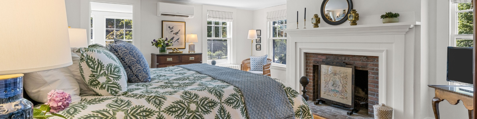 a bedroom with a bed and a chair