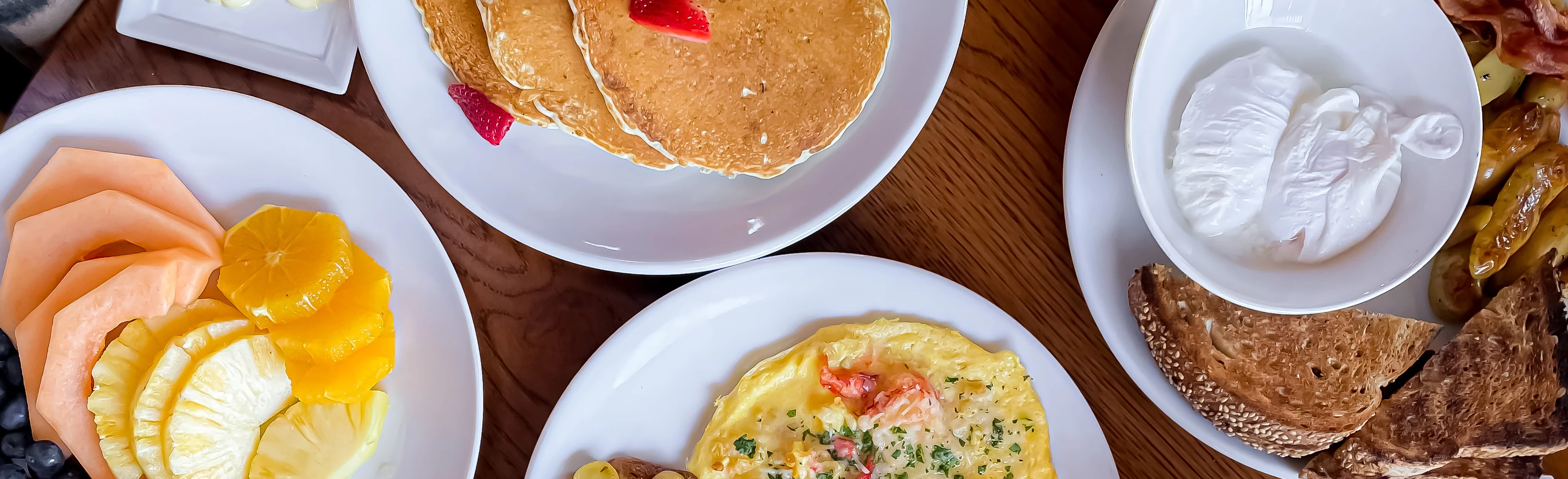 a plate of pancakes and a plate of food