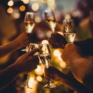 new years eve celebration cheers with champagne glasses