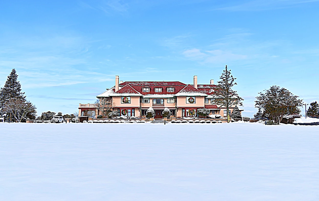 a large house with a large lawn in the snow
