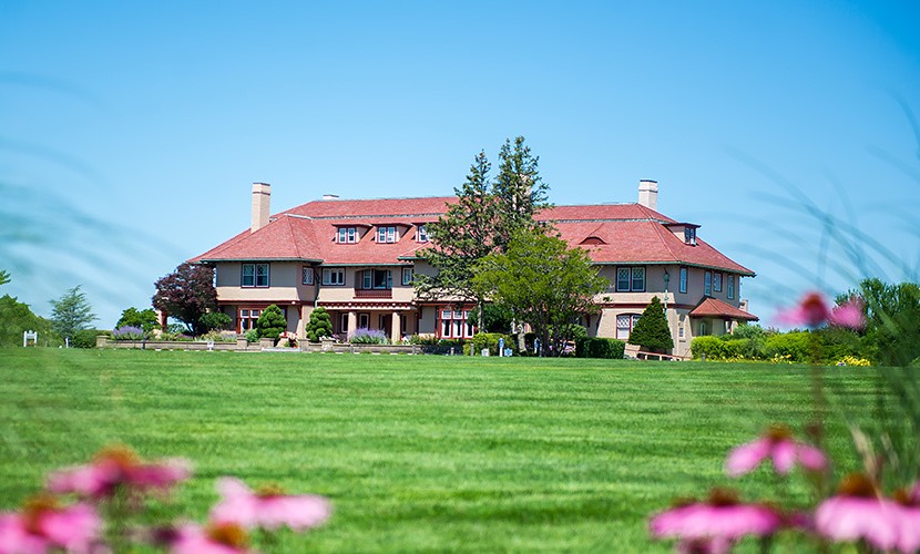 a large house with a lawn in front of it