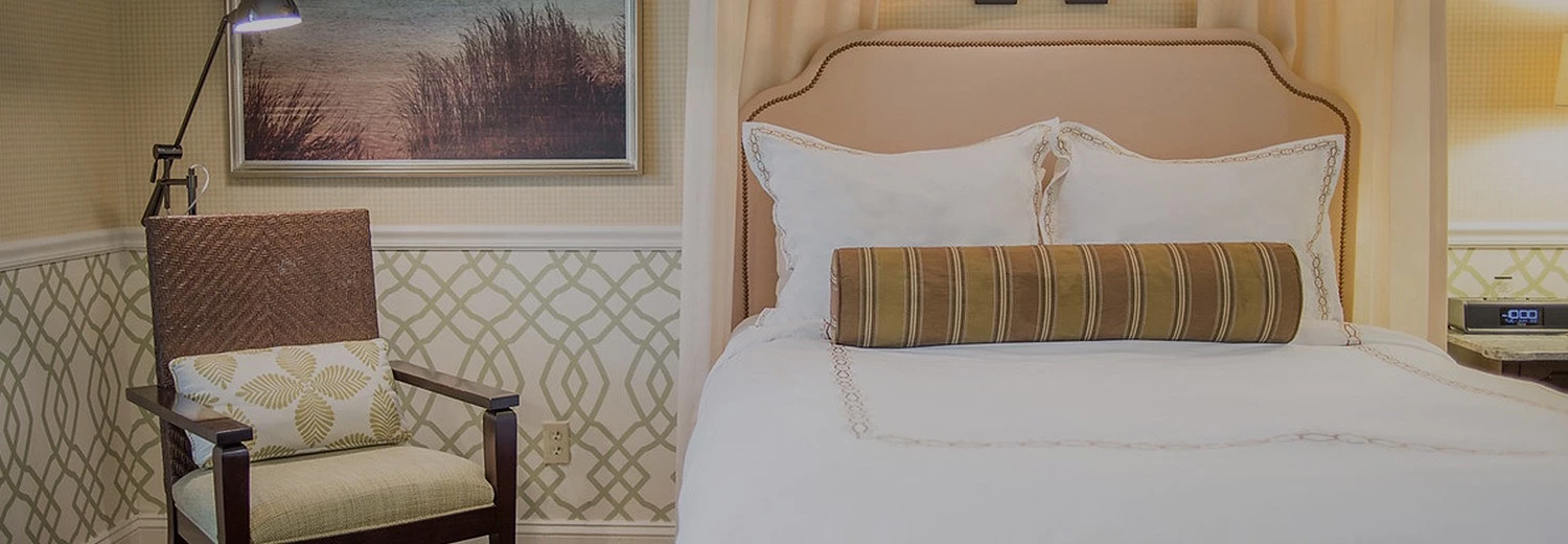 white bed with a pink headboard